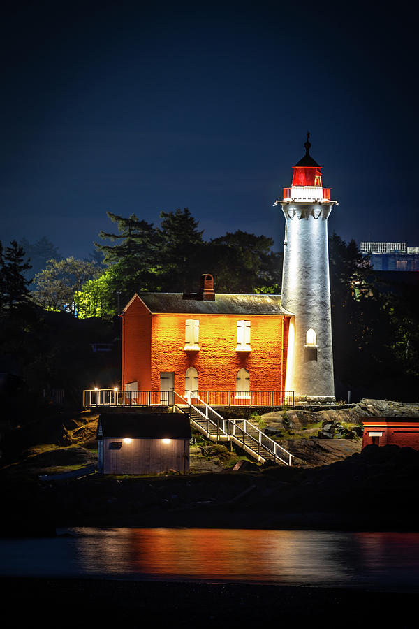 Lighthouse all lit up Photograph by Bill Cubitt