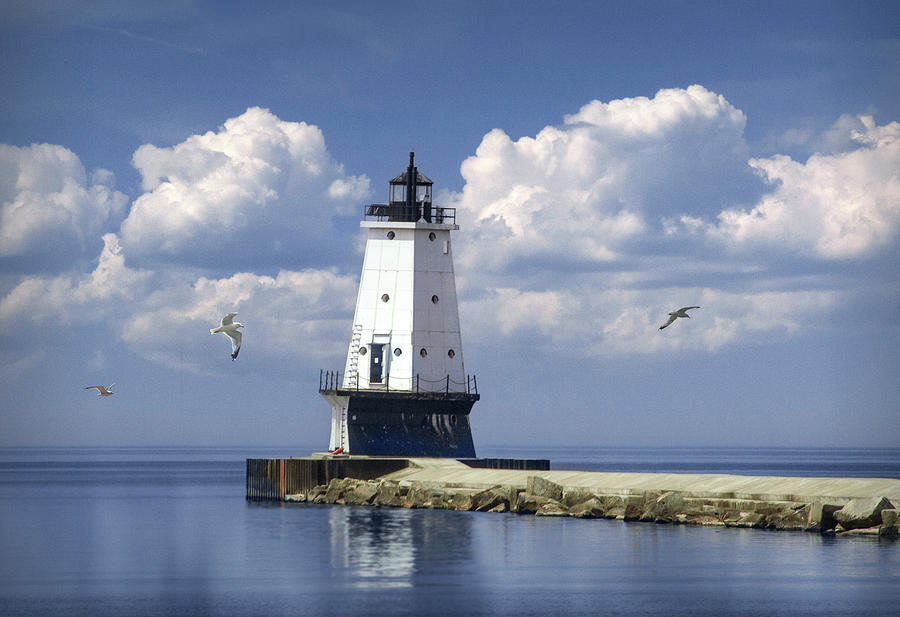 Lighthouse at the end of the Pier in Ludington Michigan with Clo Photograph by Randall Nyhof