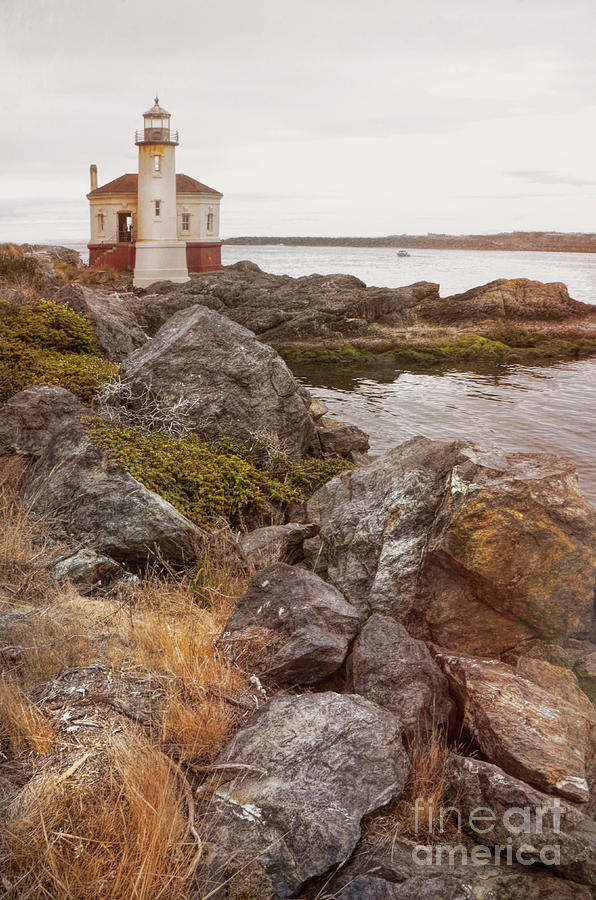 Lighthouse on Rocky Shore Photograph by Jill Battaglia