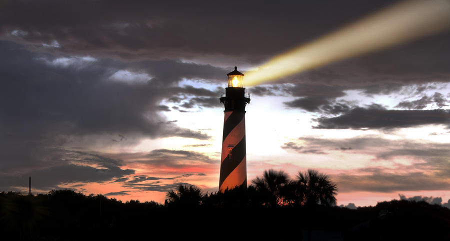 Lighthouse Search Beam At Sunset Photograph by Smithlandia Media