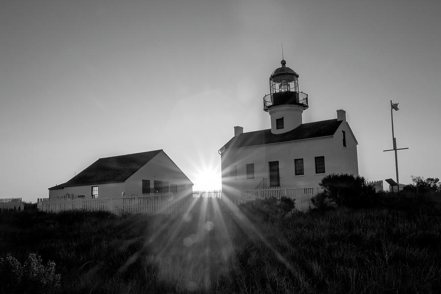 Lighthouse Sun flare  Photograph by Gina Cinardo