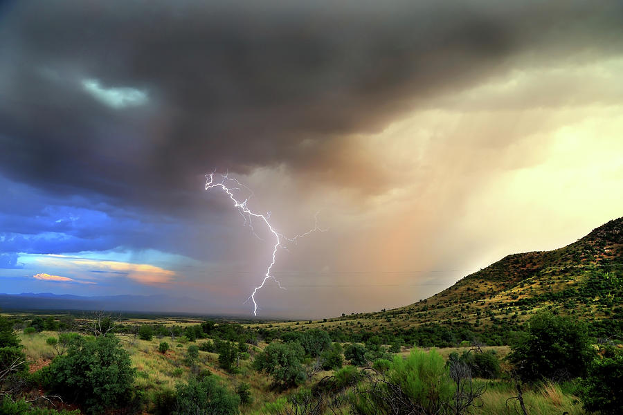 Lightning at the Border Photograph by Glen Loftis