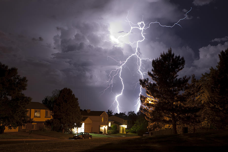 Lightning bolt and thunderhead storms over Denver neighborhood homes Photograph by Milehightraveler