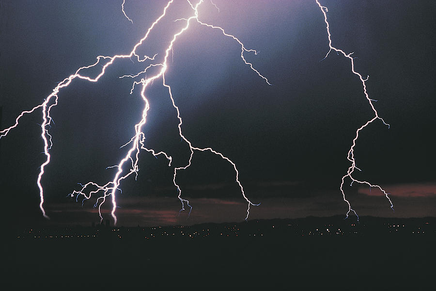 Lightning in night sky Photograph by Comstock