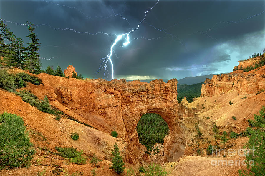 Lightning Over Natural Bridge Formation Bryce Canyon National Park Photograph by Dave Welling