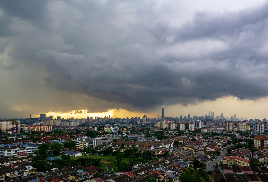 Lightning storm over downtown Kuala Lumpur skyline during monsoon season. Photograph by Shaifulzamri