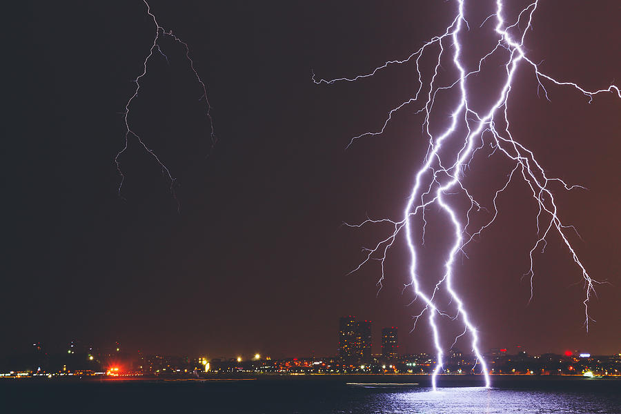 Lightning Strike Over City Photograph by Serts