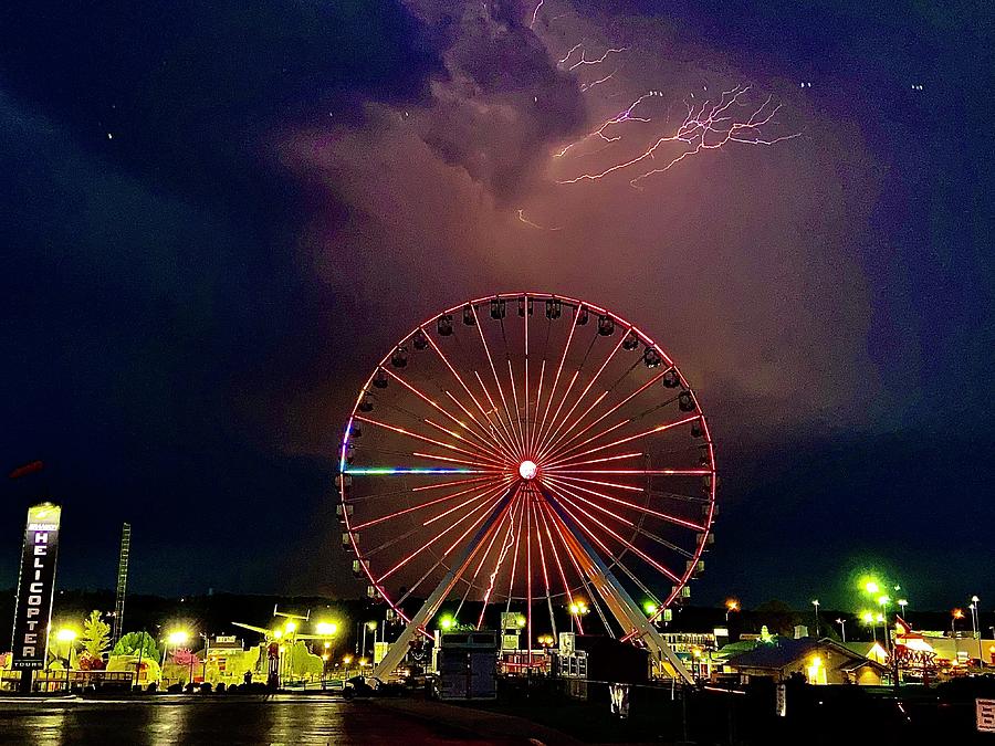 Lightning Towers the Ferris Wheel Photograph by Michael Oceanofwisdom Bidwell