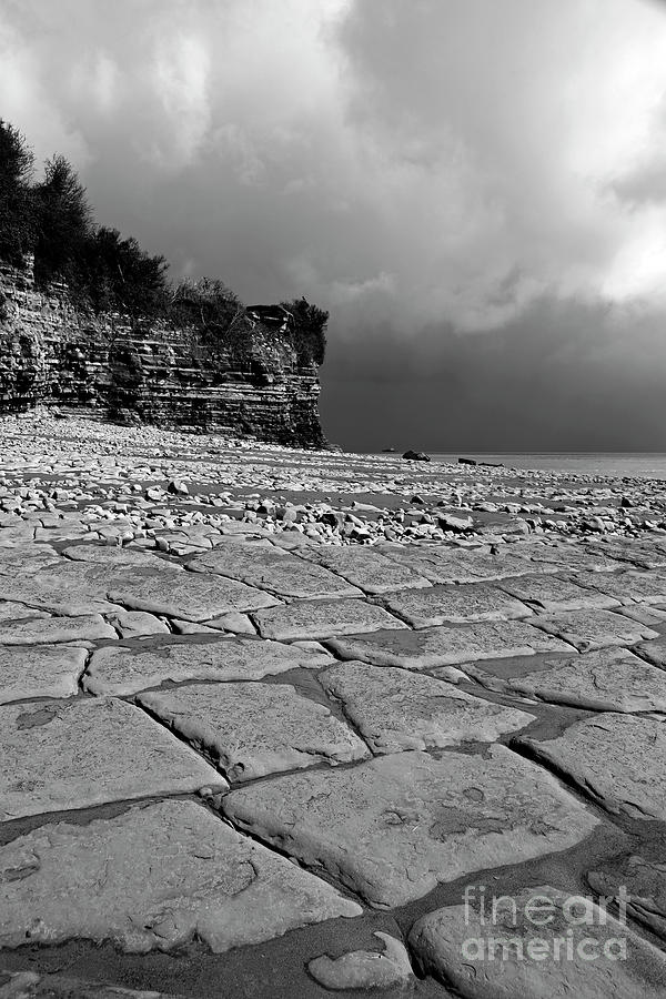 Limestone pavement at Lavernock Point in monochrome South Wales UK Photograph by James Brunker
