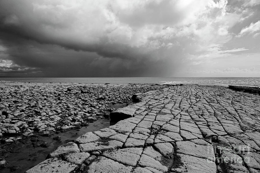Limestone pavement on the Glamorgan Heritage Coast in monochrome Wales Photograph by James Brunker
