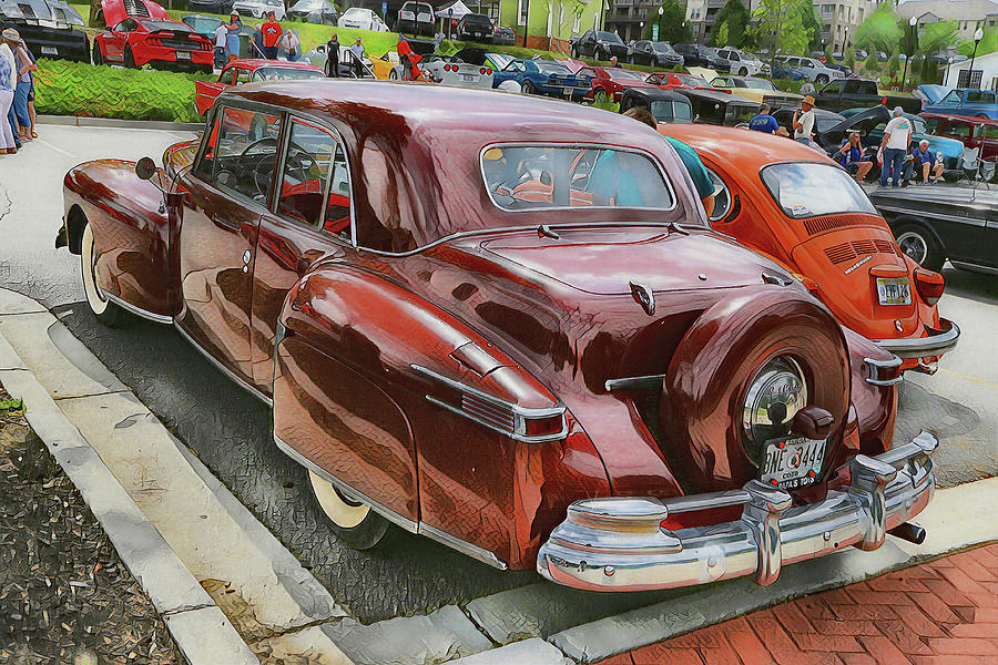 Lincoln Continental beside bug  Photograph by Dennis Baswell