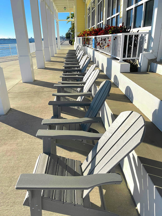 Line of Adirondack Chairs Photograph by Debra and Dave Vanderlaan