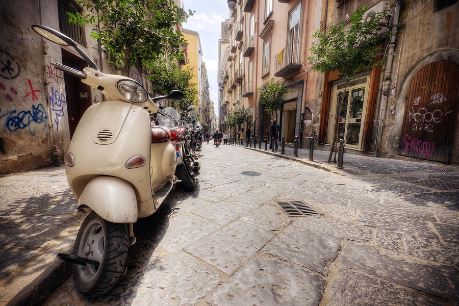 Line of Vespas on an Italian street in the summer Photograph by DaveLongMedia