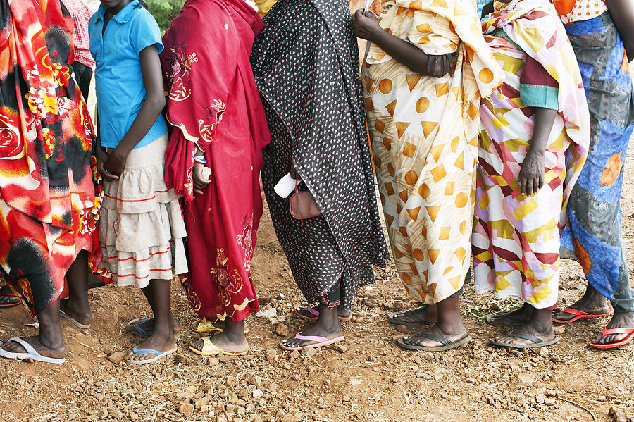 Line of women wearing long and colorful dresses. Photograph by Jadwiga Figula