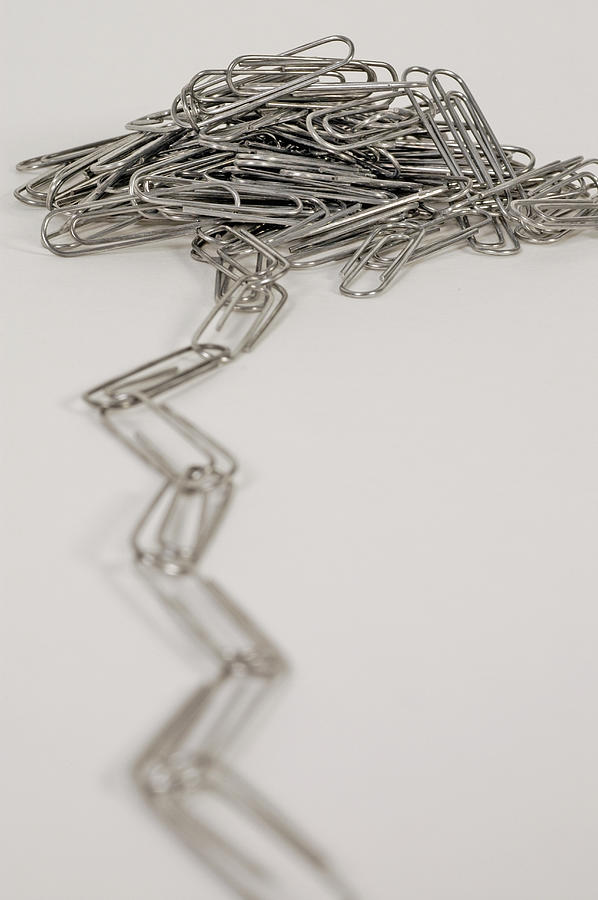 Linked Paper Clips in a Pile Photograph by Carlos Davila