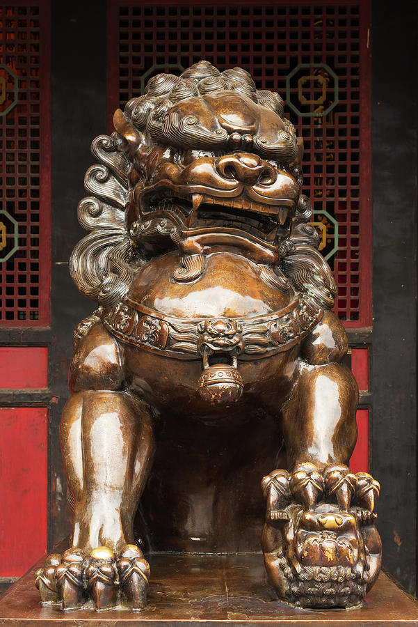 Lion bronze statue in front of a buddhist temple Photograph by Philippe Lejeanvre