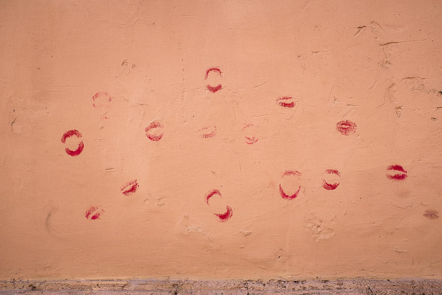 Lipstick kisses on a peach wall in Trastevere Rome Photograph by Brian Eden