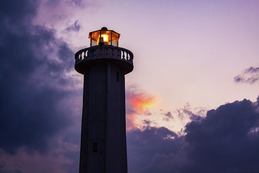 Lighthouse illuminated at dusk Photograph by Tatiana Travelways