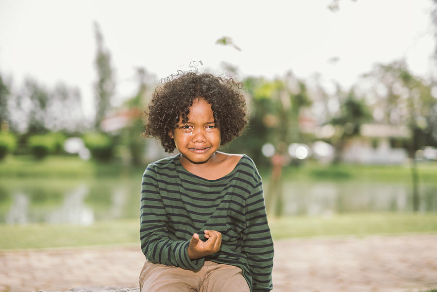 little African american boy crying Photograph by Pondsaksit