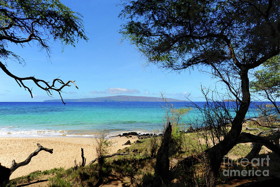 Little Beach on Maui looking over at the island of Lanai.	 Photograph by Gunther Allen