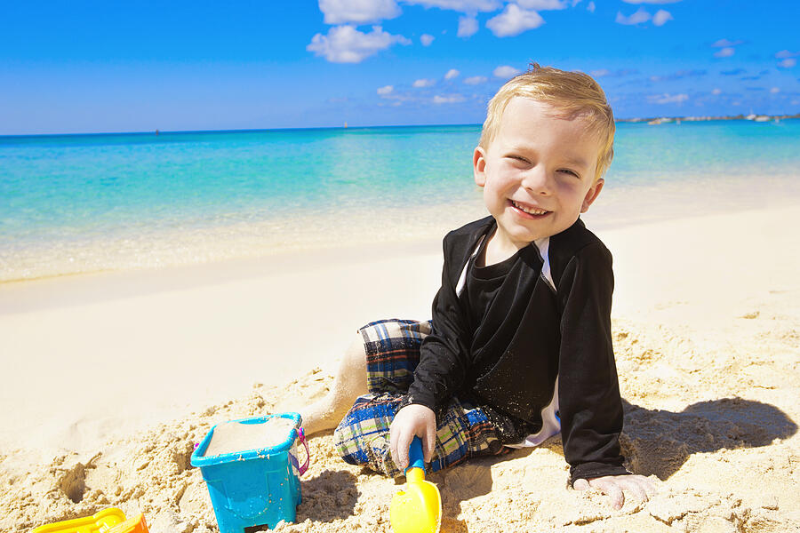 Little Boy Playing in the Sand on Beach Photograph by Yobro10