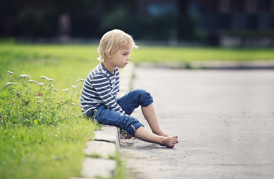 Little boy sitting on the sidewalk Photograph by Mrs