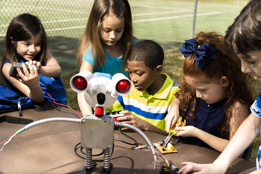 Little engineers!  Elementary children collaborate on robot they created. Photograph by Fstop123