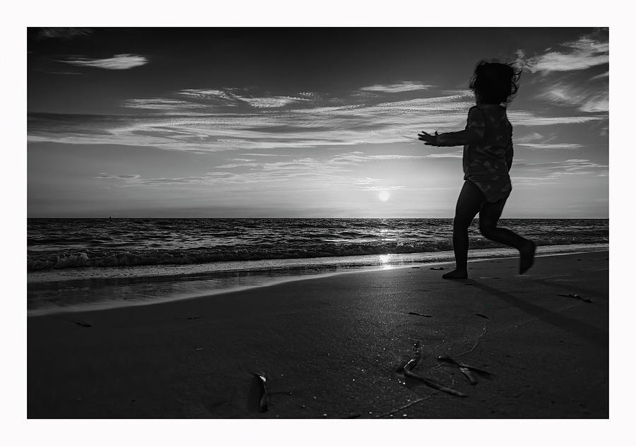 Little girl chasing the sun Photograph by ARTtography by David Bruce Kawchak