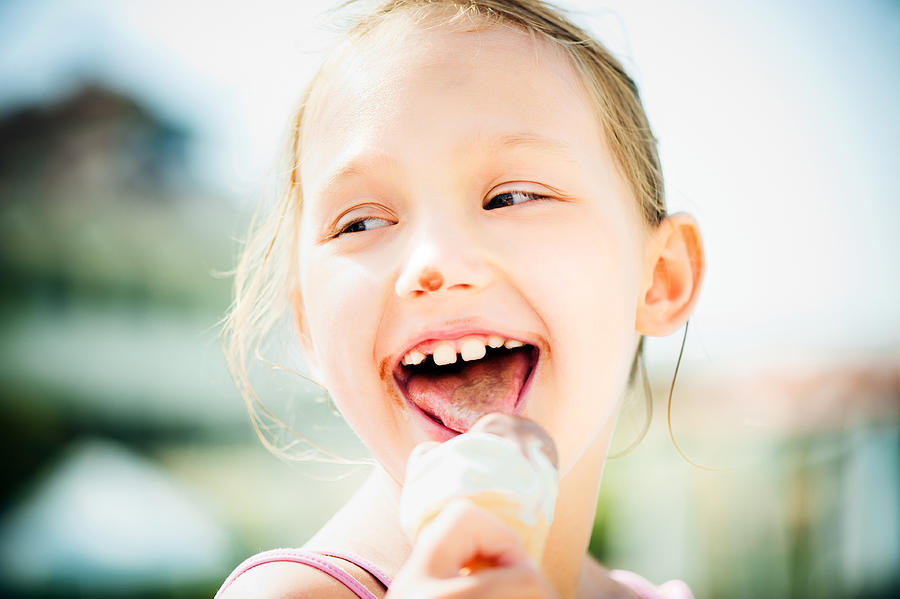 Little girl eating ice-cream Photograph by ArtMarie