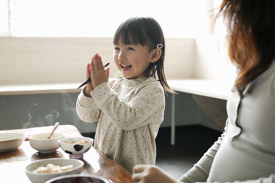 Little girl eating meal,smiling Photograph by Sot