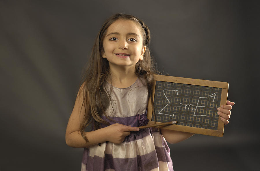 Little girl holding small blackboard with formula Photograph by Jac Depczyk