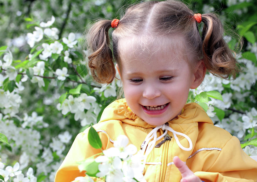 Little Girl Near Blossoming Apple Tree Photograph by Mikhail Kokhanchikov