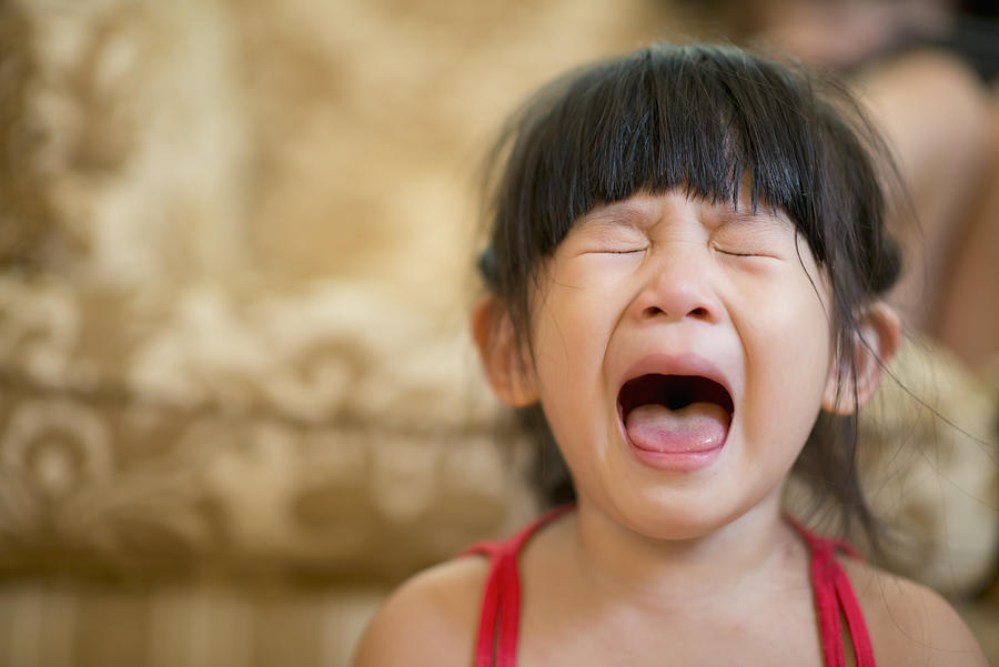 Little girl opening mouth and crying hysterically Photograph by Leren Lu