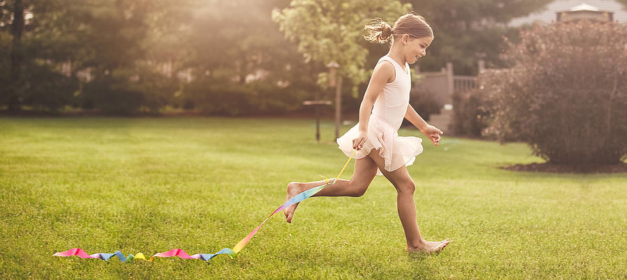 Little Girl Running With Gymnastics Ribbon Photograph by Rebecca Nelson