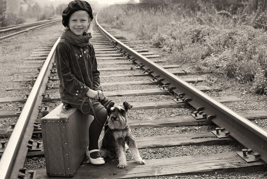 Little girl traveling with her dog. The old European photo. Photograph by Nata_Snow