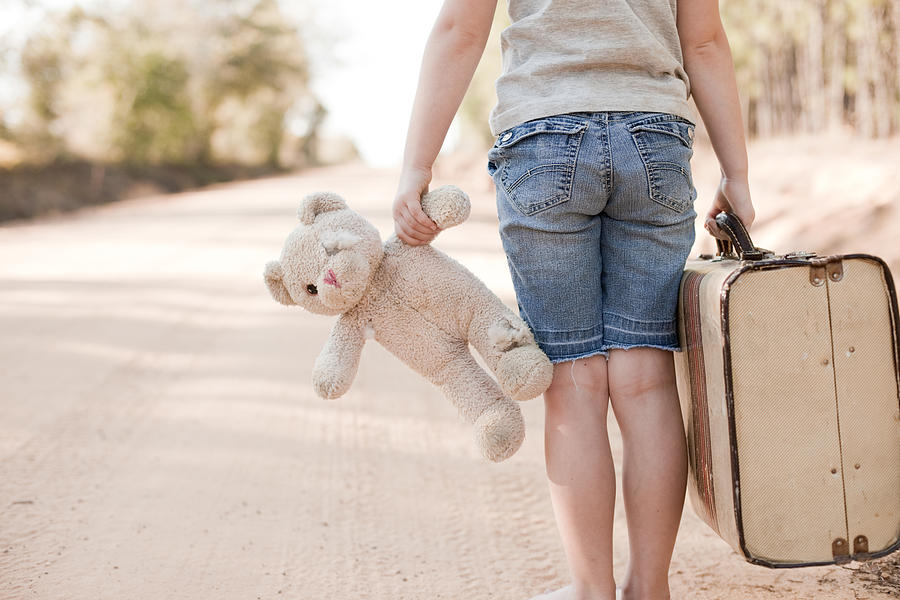 Little Girl Walking with Old Teddy Bear and Suitcase Photograph by Ideabug