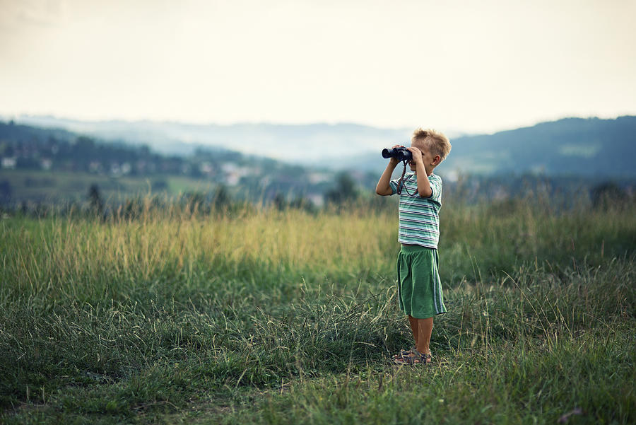 Little hiker looking at view with binoculars Photograph by Imgorthand