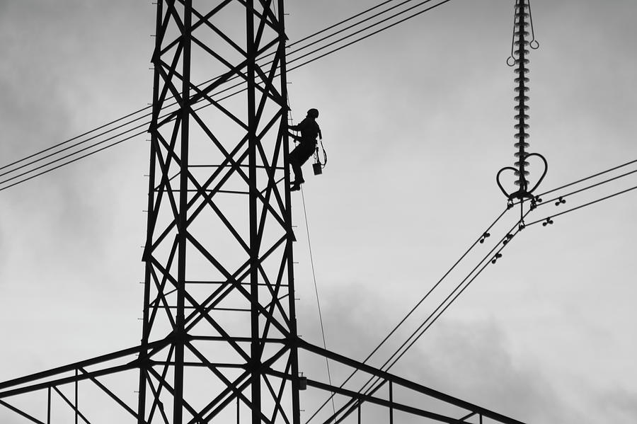 Live Wire Worker Photograph by Stuart Allen