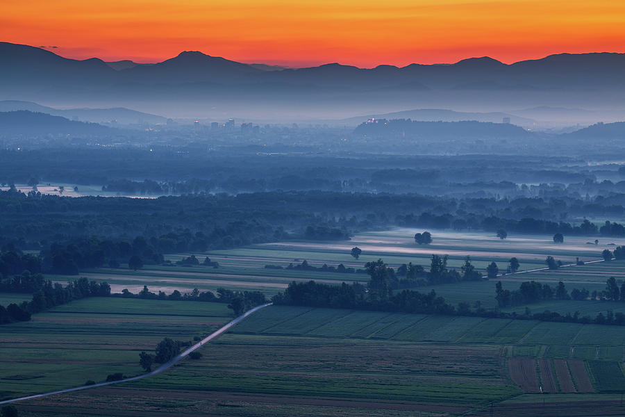Ljubljana in the distance at sunrise Photograph by Ian Middleton