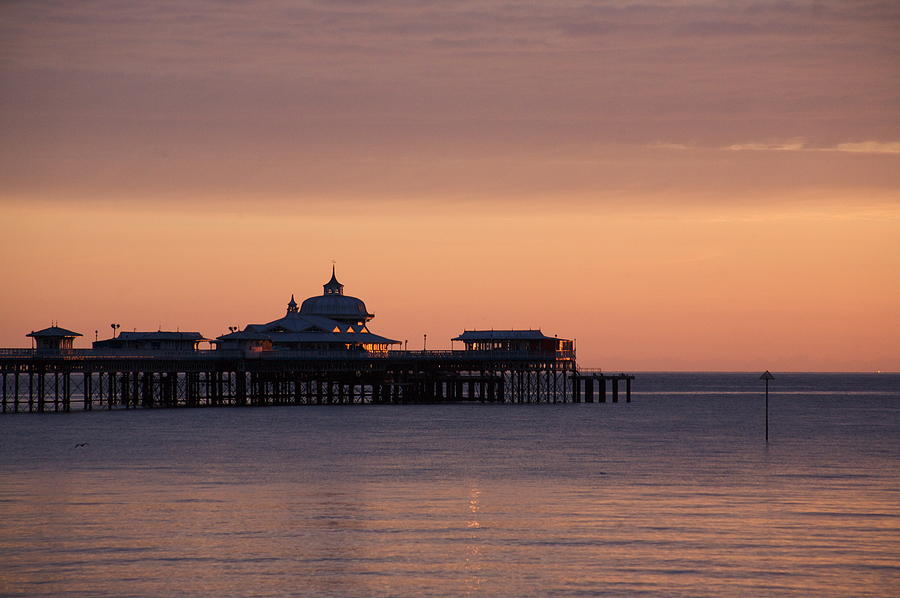 Llandudno pier at dawn Photograph by Christopher Rowlands