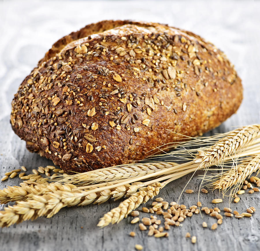 Bread Photograph - Loaf of multigrain bread by Elena Elisseeva
