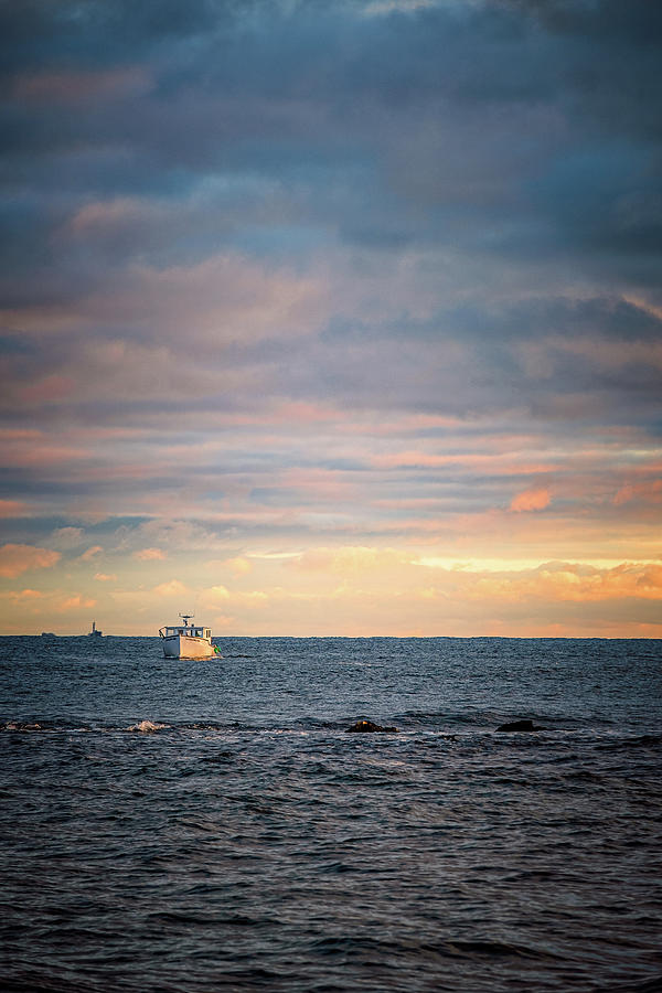 Lobster Boat On The Sea At Sunset.  Photograph by Jeff Sinon