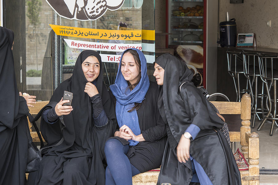 Local and foreign women taking a selfie, Yazd, Iran Photograph by Guenterguni