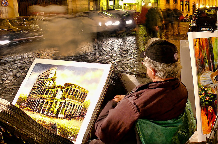 Local artist selling paintings at night in Rome, Italy Photograph by Photo by Victor Ovies Arenas