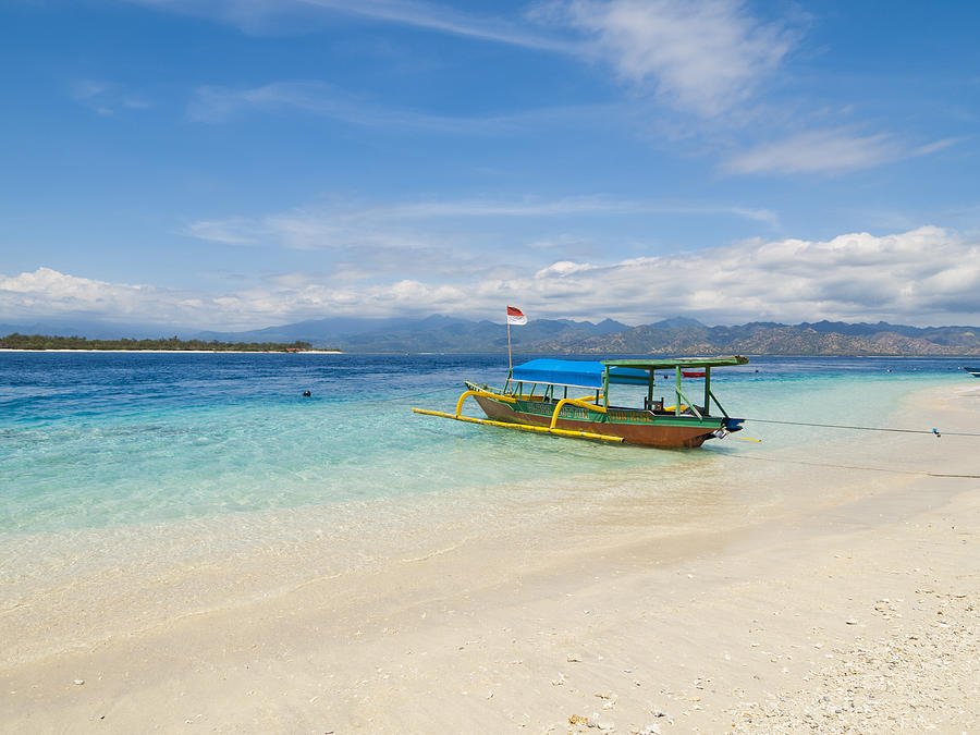 Local style outrigger boat, Gili Trawangan, Indonesia Photograph by Holgs