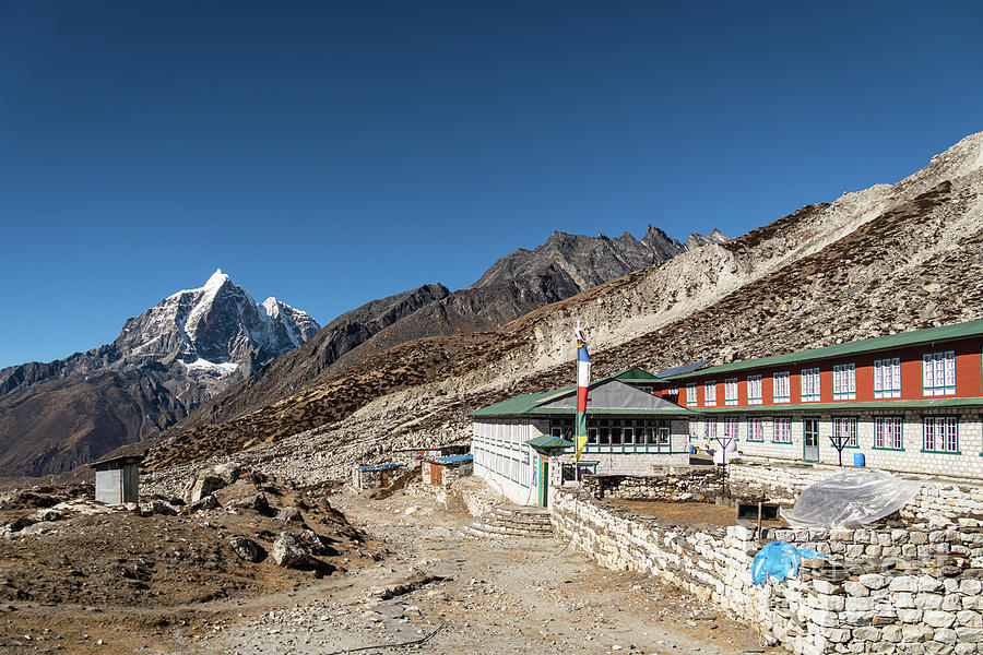 Lodges in the remote Chukung valley with Taboche peak in the bac Photograph by Didier Marti