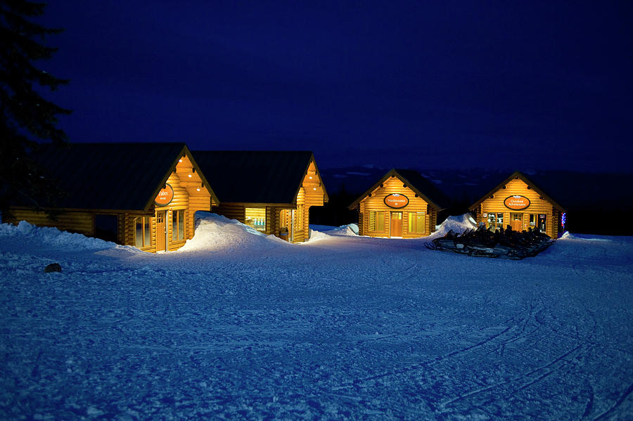 Log cabins at night Photograph by David L Moore