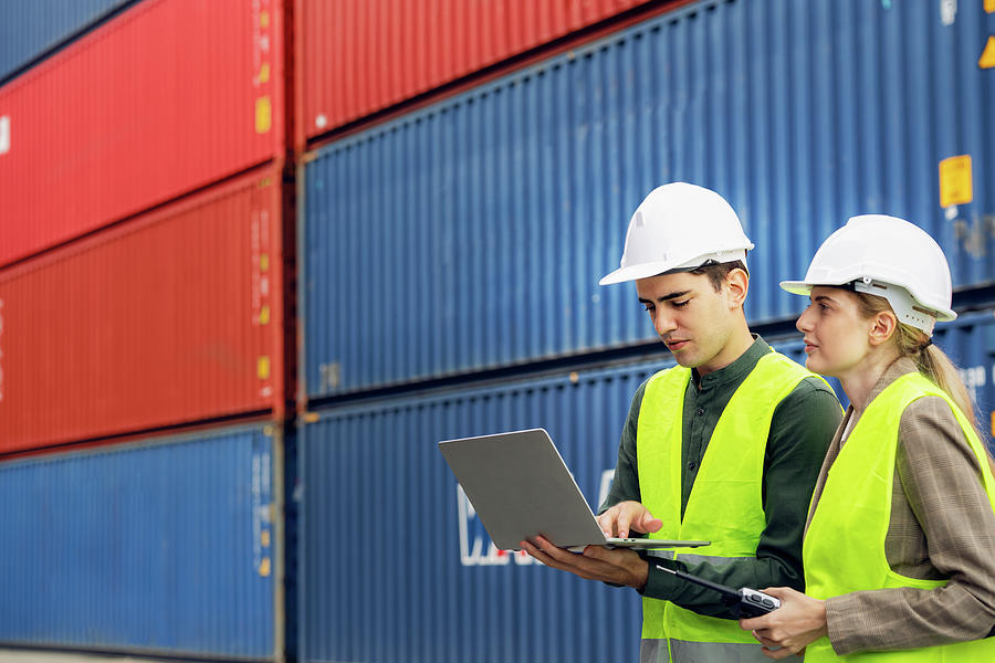 Logistics staff working togather in container storage area Photograph ...