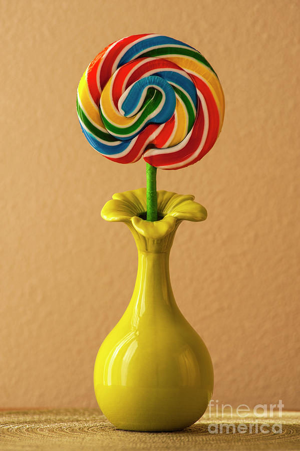 Lollipop In Green Vase Photograph