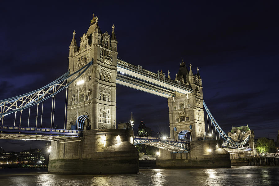 London Tower Bridge illuminated over River Thames at dusk Photograph by fotoVoyager